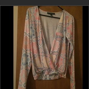 Long sleeve. Plunging neckline